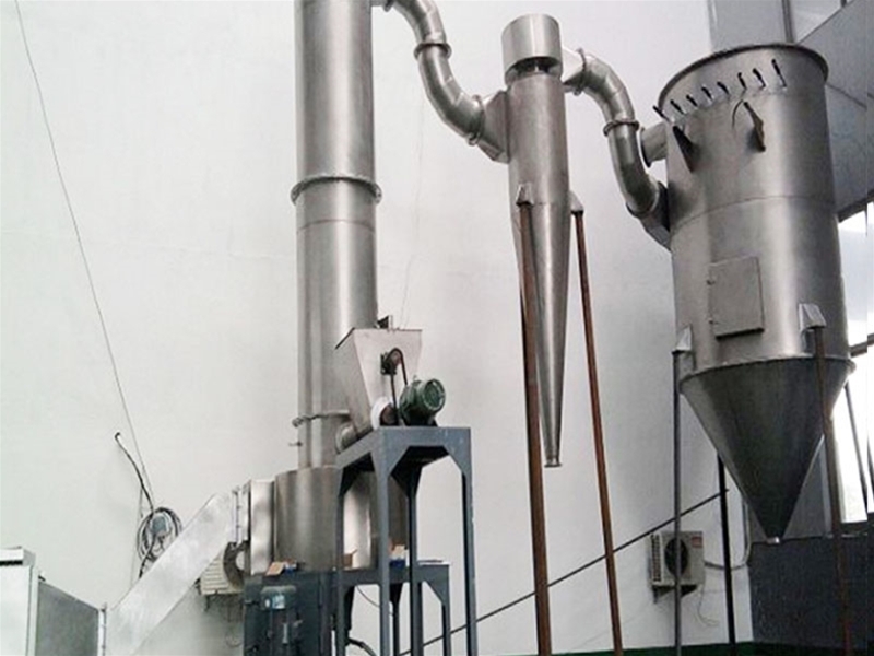 Alkaline oxide rotary flash dryer